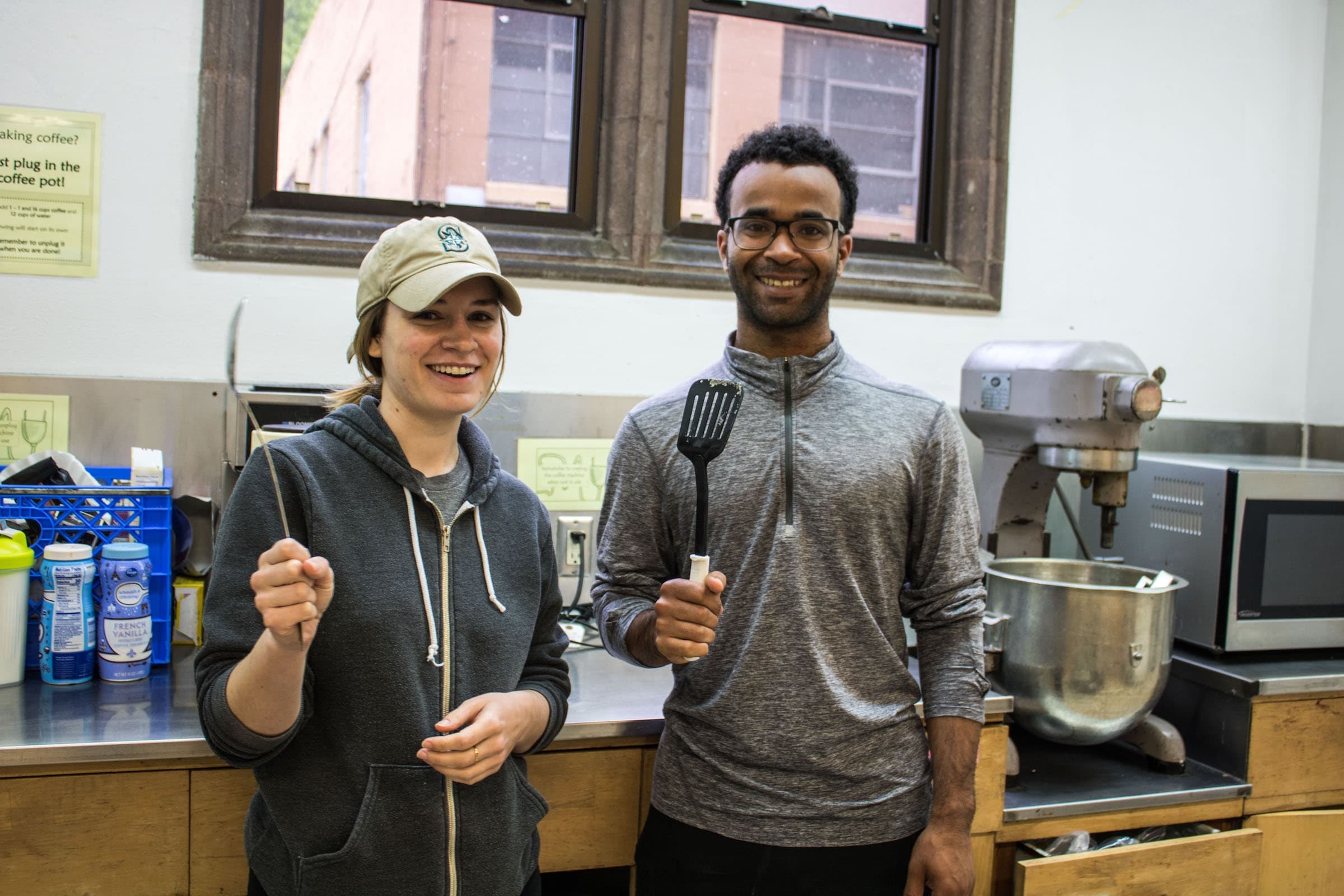 Two students smiling